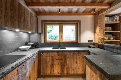 a kitchen with a sink and a window at Superb Chalet Isatis-renovated in Megeve in Megève