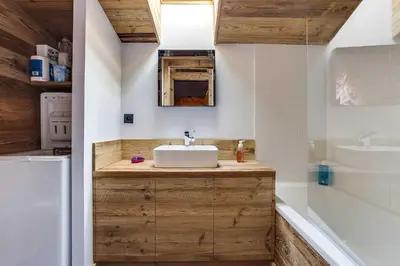a bathroom with a sink and a bath tub at Cozy 2BDR-5P apartment near the ski slopes in Megève