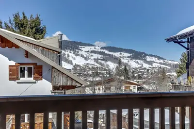 a view of a snowy mountain from a balcony at Cozy 2BDR-5P apartment near the ski slopes in Megève