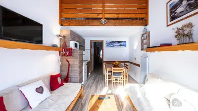 a living room with a couch and a table at Grand Morillon N404 2P6 Mezzanine in Morillon