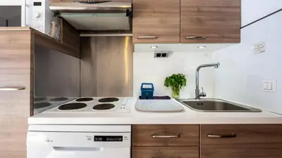 a kitchen with a stove and a sink at Grand Morillon N404 2P6 Mezzanine in Morillon