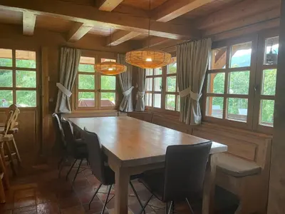 a dining room with a wooden table and chairs at Chalet Grand Standing à Megève - 5 min des Pistes, 5 Chambres, 10 Pers. - FR-1-432-95 in Megève