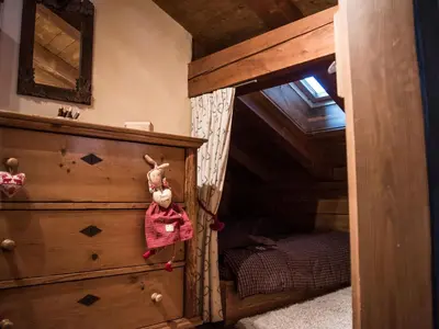 a childs bedroom with a bed and a dresser at Chalet Grand Standing à Megève - 5 min des Pistes, 5 Chambres, 10 Pers. - FR-1-432-95 in Megève