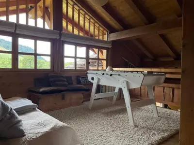 a ping pong table in a room in a cabin at Chalet Grand Standing à Megève - 5 min des Pistes, 5 Chambres, 10 Pers. - FR-1-432-95 in Megève