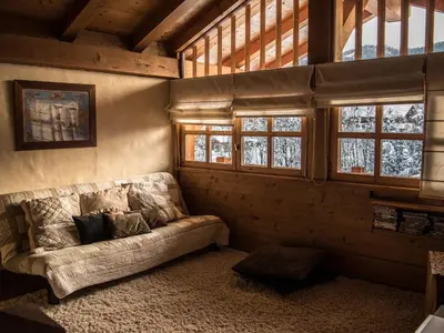 a living room with a couch in a room with windows at Chalet Grand Standing à Megève - 5 min des Pistes, 5 Chambres, 10 Pers. - FR-1-432-95 in Megève