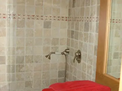 a shower with a red object in a bathroom at Chalet Grand Standing à Megève - 5 min des Pistes, 5 Chambres, 10 Pers. - FR-1-432-95 in Megève