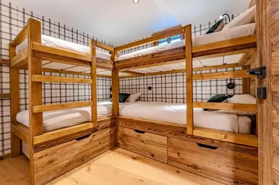 a room with two bunk beds in it at Luxurious Chalet with Sauna & Jacuzzi in Megeve with Parking in Megève