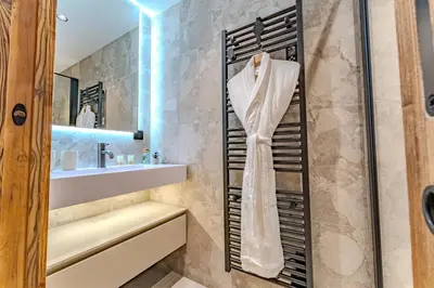 a bathroom with a sink and a shower at Luxurious Chalet with Sauna & Jacuzzi in Megeve with Parking in Megève