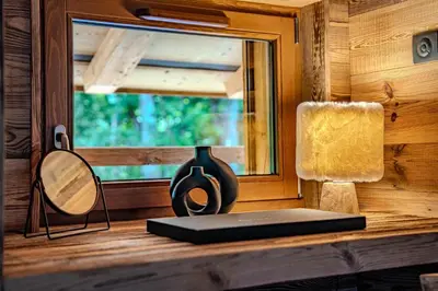 a laptop sitting on a table with a window at Luxurious Chalet with Sauna & Jacuzzi in Megeve with Parking in Megève