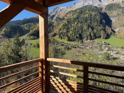 a view from a cabin balcony with a view of a mountain at Contamines Montjoie appartement 2 chambres et cabine in Les Contamines-Montjoie