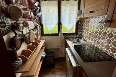 a small kitchen with a sink and a stove at Stay at the heart of the slopes in Megève! in Megève
