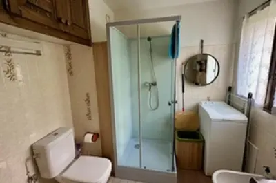 a bathroom with a shower and a toilet and a sink at Stay at the heart of the slopes in Megève! in Megève