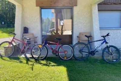 three bikes parked in front of a house at Stay at the heart of the slopes in Megève! in Megève