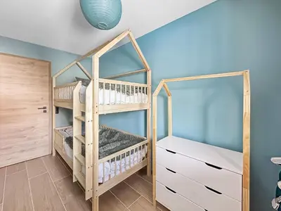 a room with a bunk bed and a closet at DBA003 - 4 pieces 6 pers neuf centre in Les Carroz d'Araches