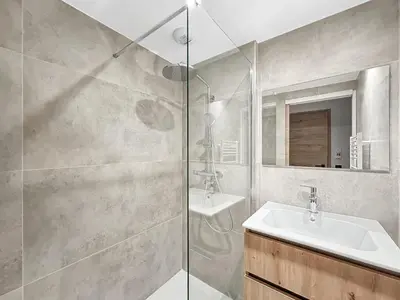 a bathroom with a sink and a shower at DBA003 - 4 pieces 6 pers neuf centre in Les Carroz d'Araches