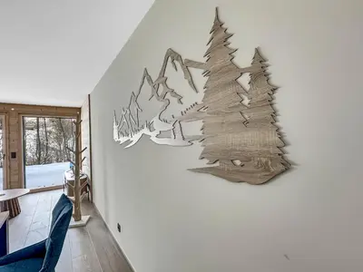 a mural of a christmas tree on a wall at DBA003 - 4 pieces 6 pers neuf centre in Les Carroz d'Araches