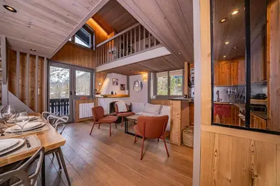 a kitchen and living room of a house at Balcons de Champraz- Spectacular Mont Blanc and Lake Views in Chamonix-Mont-Blanc