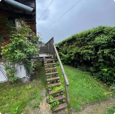 a wooden staircase leading up to a house at petit chalet in Chamonix-Mont-Blanc