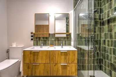 a bathroom with a sink and a shower at Beautiful new flat by the forest in Chamonix-Mont-Blanc