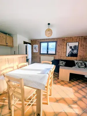 a kitchen and a dining room with a table at Appartement 60m2 avec une vue exceptionnelle in Sallanches