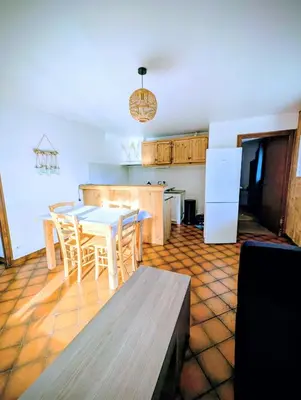 a kitchen and dining room with a table and chairs at Appartement 60m2 avec une vue exceptionnelle in Sallanches