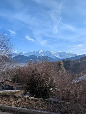 a view of snow capped mountains in the distance at Appartement 60m2 avec une vue exceptionnelle in Sallanches