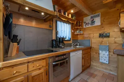 a kitchen with a sink and a stove at Tete aux Vents - Chalet Familial Centre Vue Randos Parking in Chamonix-Mont-Blanc