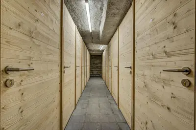 a building on the side of a snowy mountain at Kayla - Cosy 4pax Remontees 5mn Vue SPA Garage in Les Houches