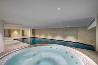 a hallway with wooden walls and a ceiling at Kayla - Cosy 4pax Remontees 5mn Vue SPA Garage in Les Houches