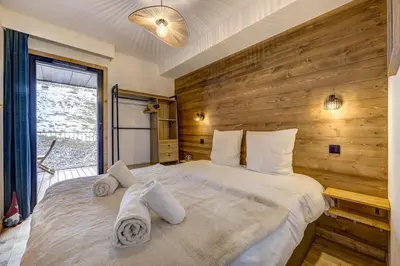a large swimming pool in a building at Kayla - Cosy 4pax Remontees 5mn Vue SPA Garage in Les Houches
