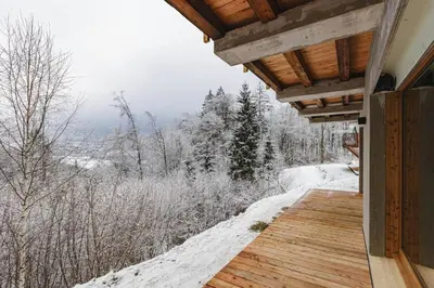 a porch of a house with snow on the ground at 7 Summits - Chalet 230m2 Salon Cathedrale Vues Cheminee in Les Houches