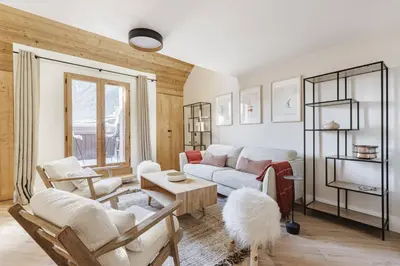 a living room with a couch and a table at Ciel - Duplex 100m2 Centre Vues Parking 3CH 3SDB in Chamonix-Mont-Blanc