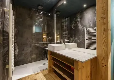a bathroom with two sinks and a large mirror at Loft Bellevue Remonte Centre Piscine Parking in Les Houches
