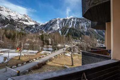 a view of a snow covered mountain from a building at Fontanes - Duplex 200m Grands Montets Balcon Vue Parking in Chamonix-Mont-Blanc