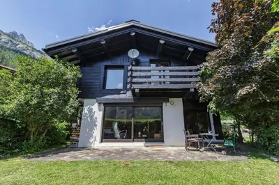 a blue and white house with a balcony at Beugeant - Cosy Chalet 140m2 Vues Calme Garage in Chamonix-Mont-Blanc