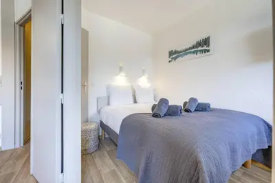 a bedroom with a bed with a blue blanket at Bouquetin - Cosy 2pax Centre Vue Parking Gare routiere in Chamonix-Mont-Blanc