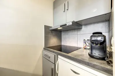 a kitchen with a counter top with a coffee maker at Bouquetin - Cosy 2pax Centre Vue Parking Gare routiere in Chamonix-Mont-Blanc