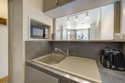 a kitchen with a sink and a microwave at Bouquetin - Cosy 2pax Centre Vue Parking Gare routiere in Chamonix-Mont-Blanc