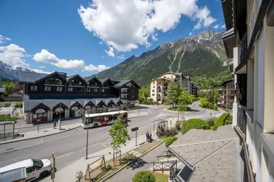a view of a street in a town with a mountain at Bouquetin - Cosy 2pax Centre Vue Parking Gare routiere in Chamonix-Mont-Blanc