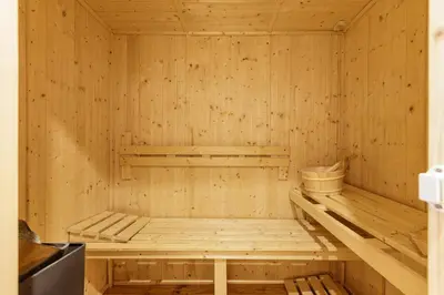 a wooden sauna with a bench in it at Ferme d Aristide - Chalet 160m2 Calme Sauna Vue Bus Train 250m in Chamonix-Mont-Blanc