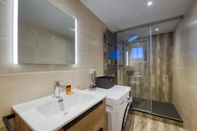 a bathroom with a sink and a shower at Lou Dava Chic Apt Near Centre Chamonix - Happy Rentals in Chamonix-Mont-Blanc
