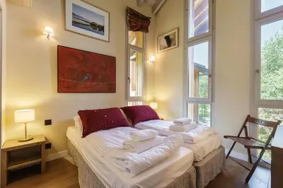 a bedroom with two beds with towels on them at Meleze - Chalet 5CH Vues Jardin Lac Remontees 200m in Les Houches