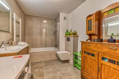 a bathroom with a sink and a toilet and a tub at Turra - Cosy 80m2 Central Remontee Parking Calme in Les Houches