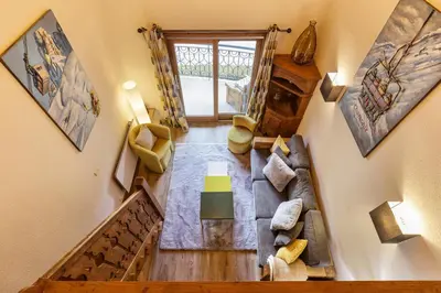 an overhead view of a living room with a couch at Cristal - Duplex Sauna Parking Remontee 300m Balcons in Chamonix-Mont-Blanc
