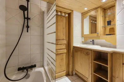 a bathroom with a shower and a tub and a sink at Cristal - Duplex Sauna Parking Remontee 300m Balcons in Chamonix-Mont-Blanc