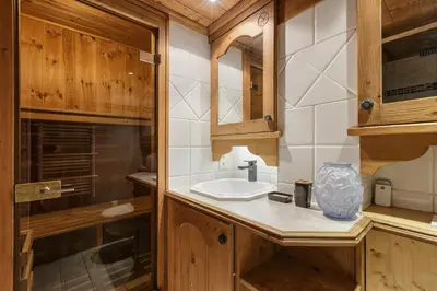 a bathroom with a sink and a mirror at Cristal - Duplex Sauna Parking Remontee 300m Balcons in Chamonix-Mont-Blanc