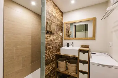 a bathroom with a sink and a mirror at Petit Balcon - Cosy 1CH Remontees 500m Vue Parking Calme in Les Houches