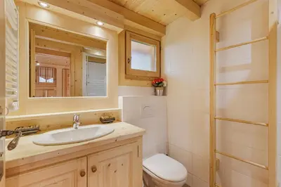 a bathroom with a sink and a toilet and a mirror at Barrats Rouge - Mazot Hypercentre 1km Nature Vues Calme in Chamonix-Mont-Blanc
