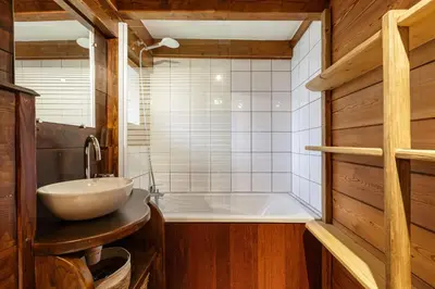 a bathroom with a sink and a bath tub at Baribal - Charmant Mazot Terrasse Nature Vue Parking in Chamonix-Mont-Blanc