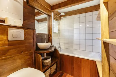 a bathroom with a toilet and a sink and a tub at Baribal - Charmant Mazot Terrasse Nature Vue Parking in Chamonix-Mont-Blanc
